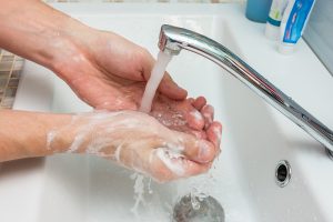 Hand sanitizing in sink